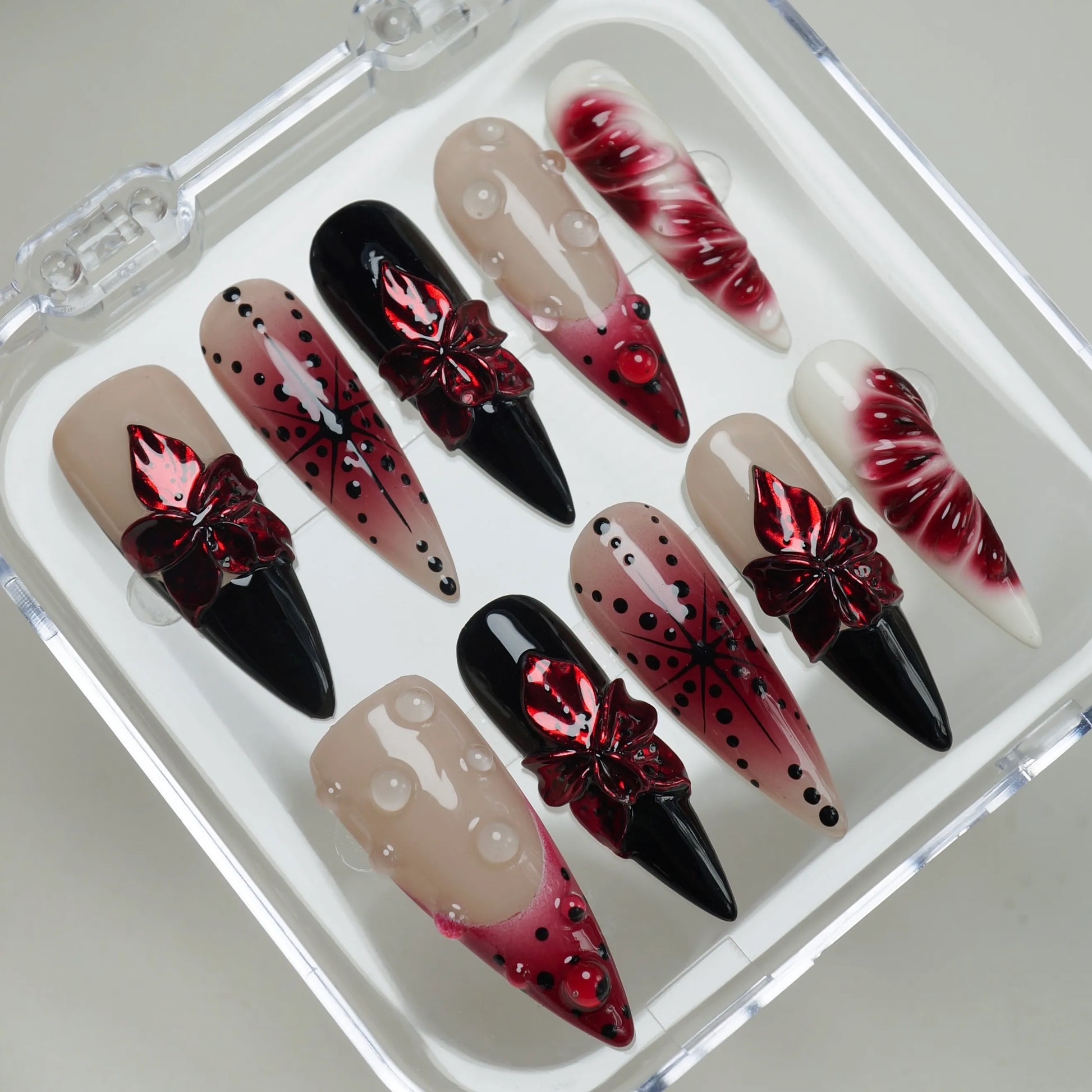 Rouge Relic press-on nails on display showing the full dark romantic floral nail art collection – Donailsart