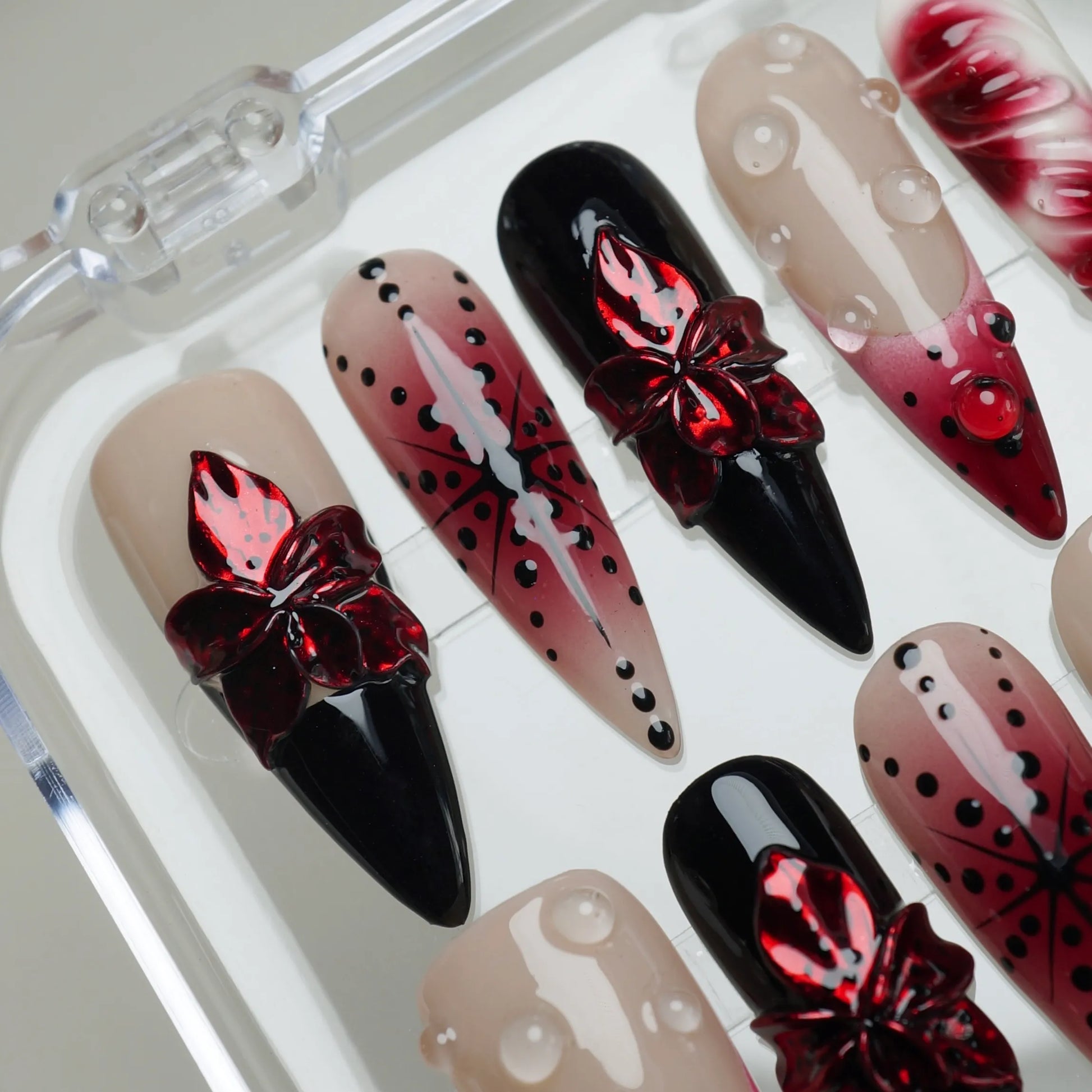 Rouge Relic press-on nail side angle featuring layered black and rouge jelly finish with preserved floral nail art – Donailsart