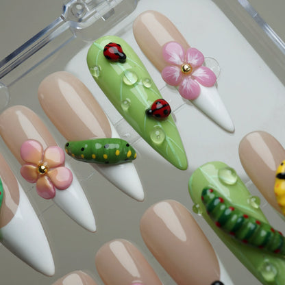 Mini Bug press-on nail set product view with cute spring garden insect and floral nail art by Donailsart