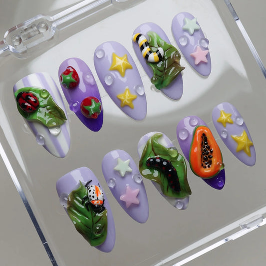Garden Juice press-on nails on display showing the full garden-themed nail art collection in pastel purple – Donailsart