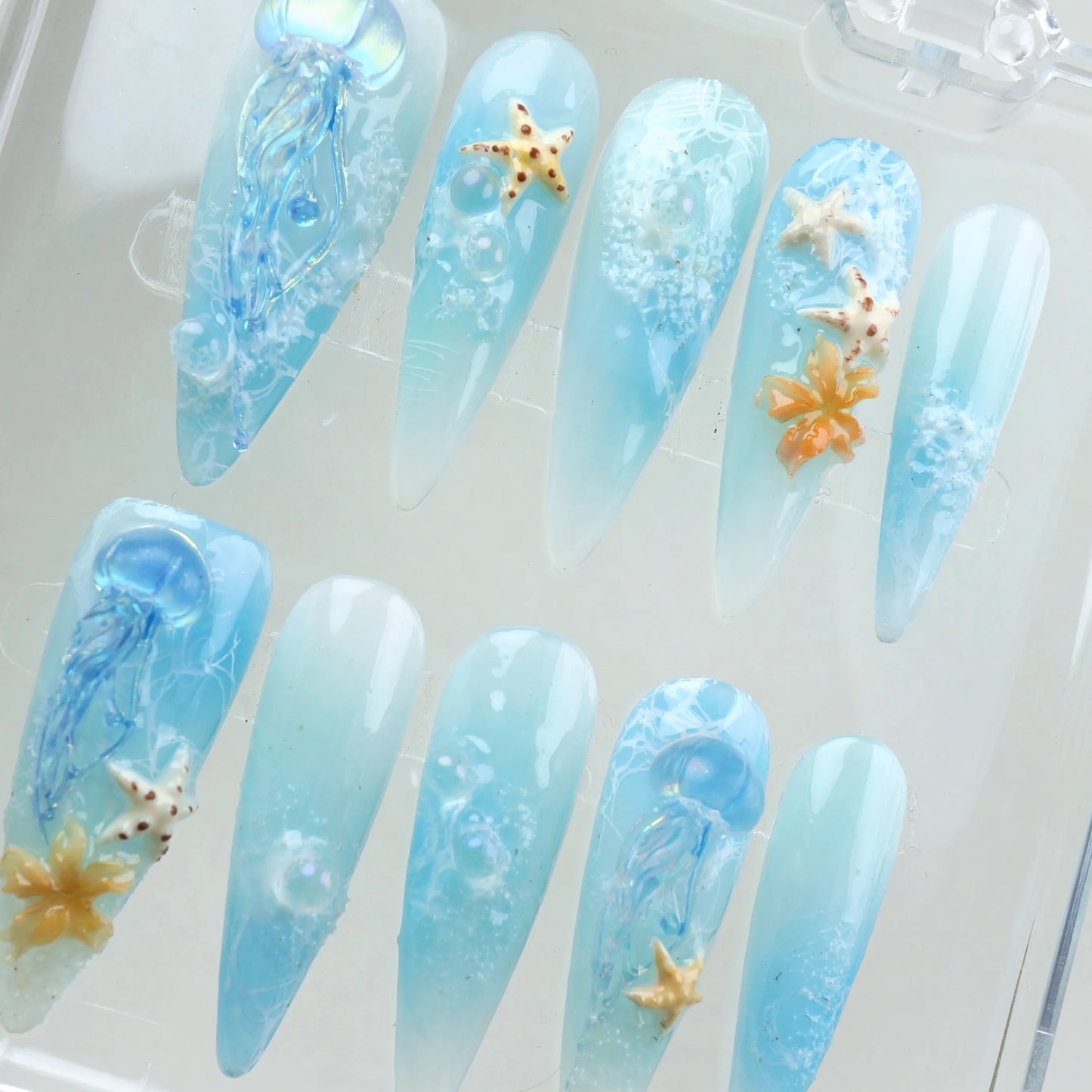Donailsart summer nails designed with ethereal waves, deep-sea shimmer, and marine life accents for a tranquil beach look