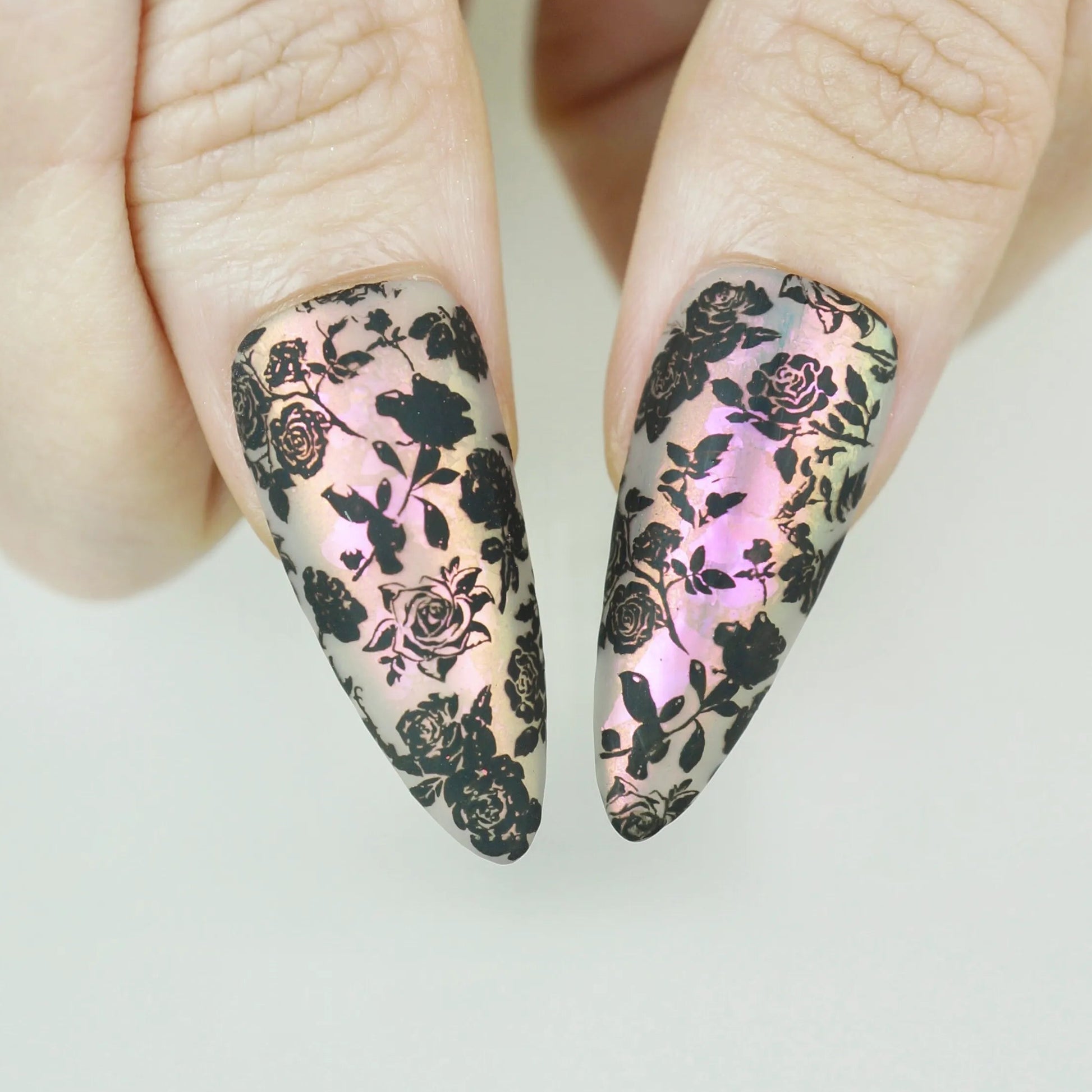 Opaline Veil close-up detail showing intricate black floral lace pattern over an iridescent pink-champagne pearlescent nail – Donailsart