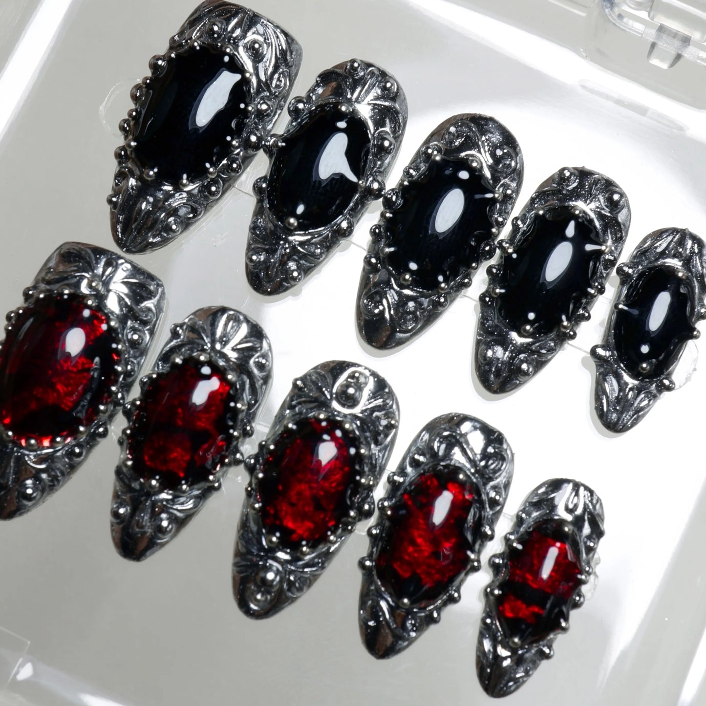 Donailsart press-on nails with antique silver settings and jewel-toned black and ruby red accents