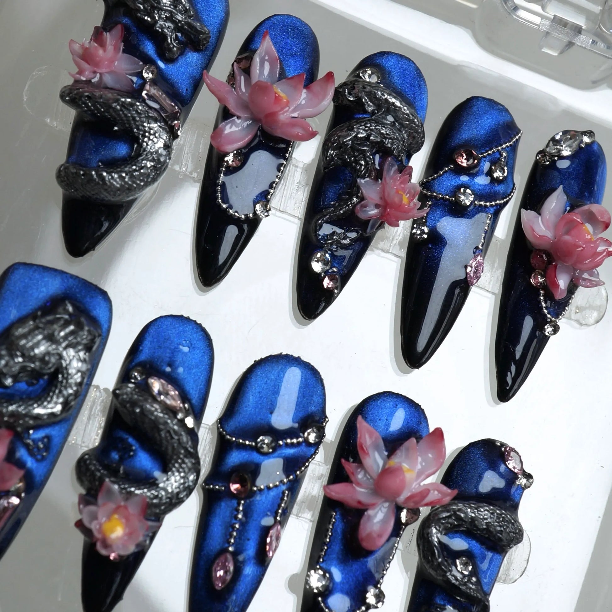 Mystical nails art by Donailsart combining metallic dragons, lotus blossoms, and gemstone embellishments