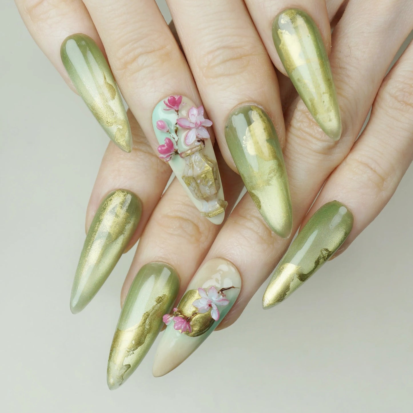 Garden Reverie press-on nails on display showing the full jade and gold sakura spring nail art collection – Donailsart