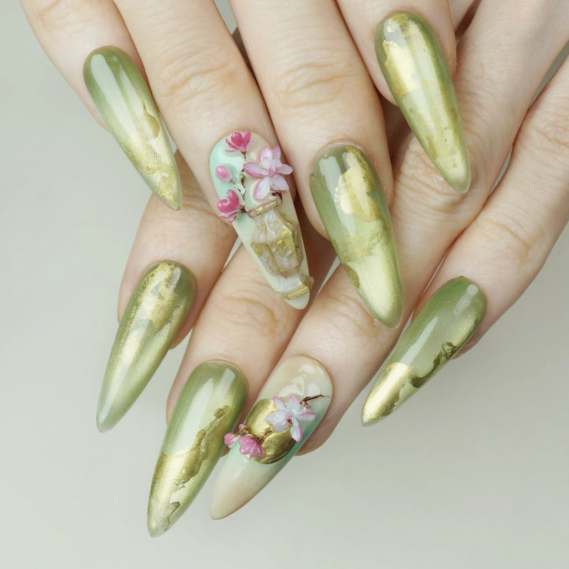 Garden Reverie press-on nails on display showing the full jade and gold sakura spring nail art collection – Donailsart