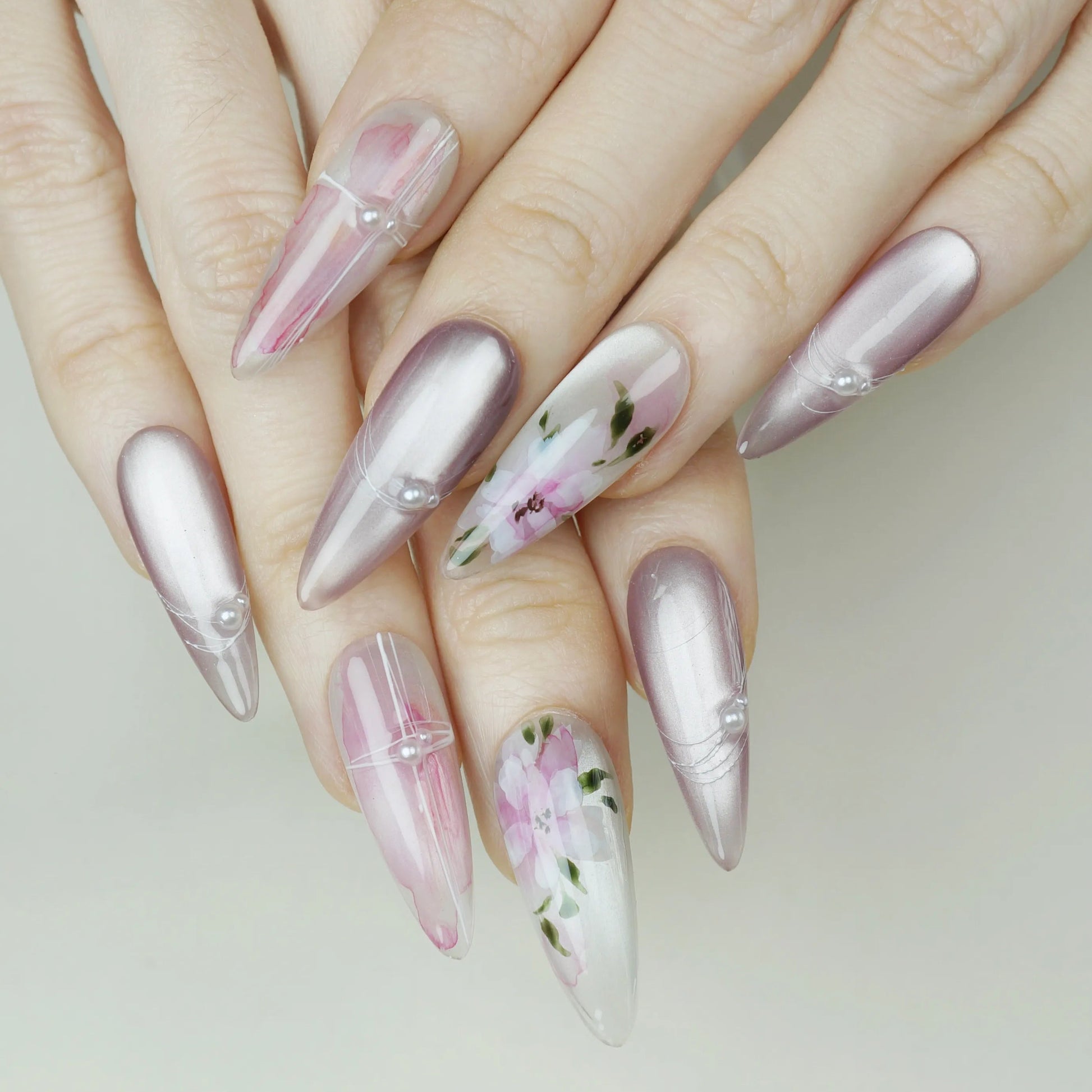 Petal Drift press-on nails on display showing the full pearl and blush pink botanical floral nail art collection – Donailsart