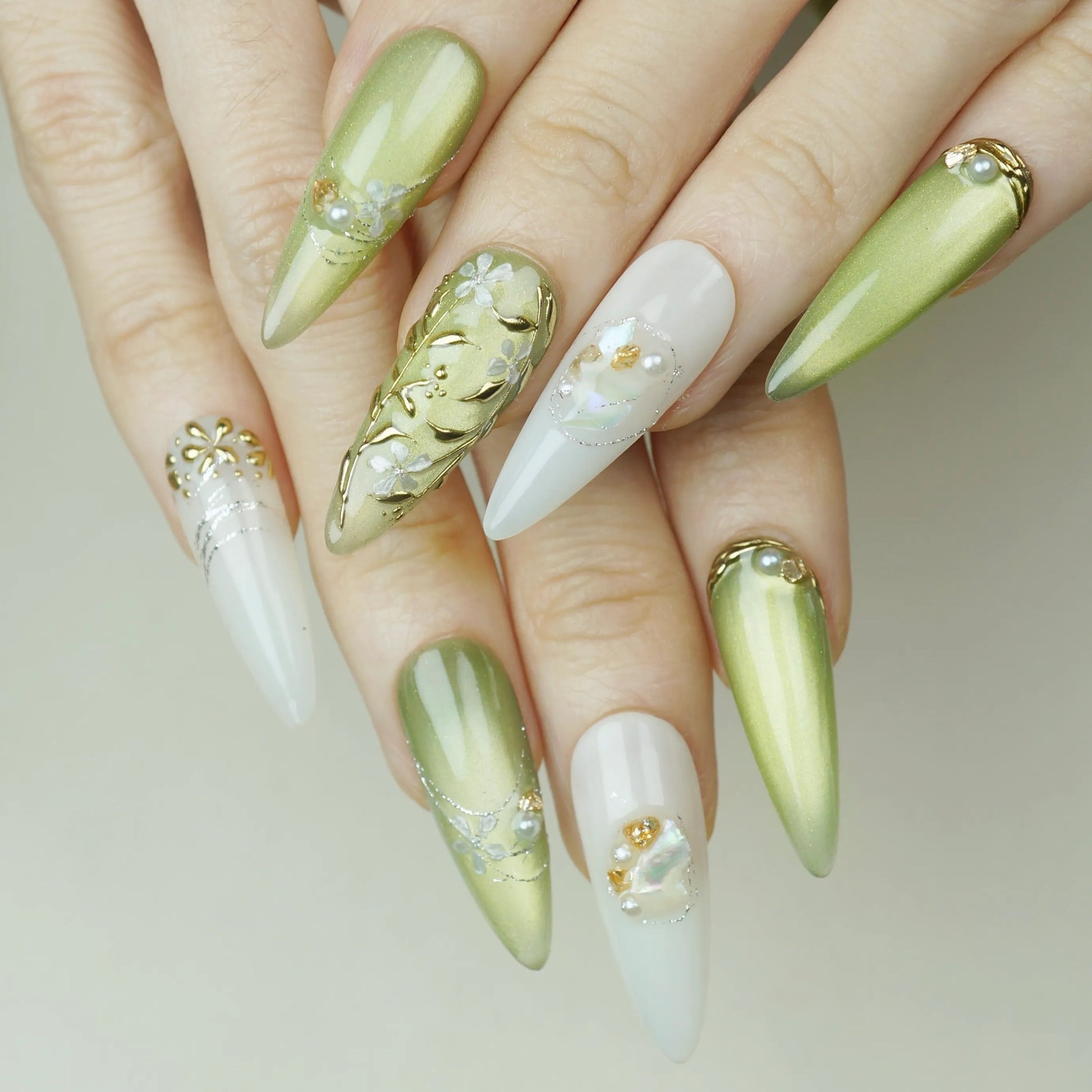 Laurel Veil press-on nails on display showing the full sage green and gold botanical nail art collection – Donailsart