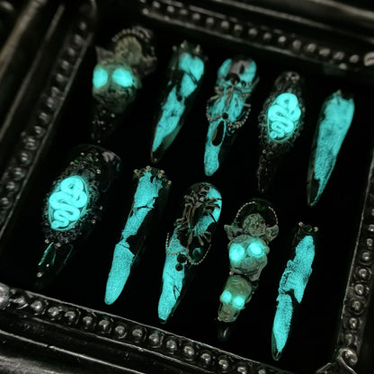 Jade Skull press-on nails glowing in the dark