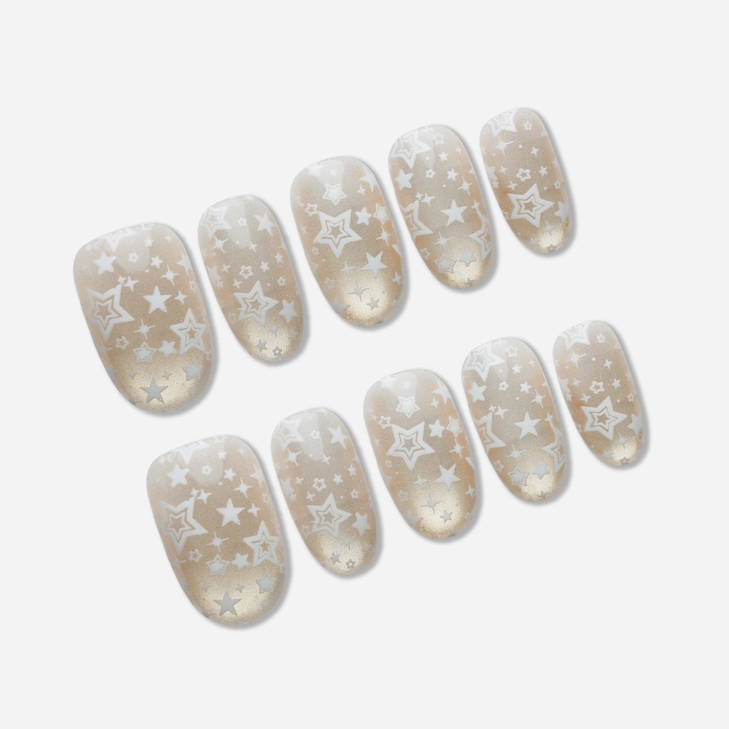 B5 | Ivory Lumen press-on nail set by Donailsart – sheer ivory base nails with warm gold shimmer and delicate star-like floating patterns