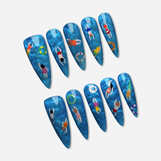 Lazy Pool Day press-on nail set by Donailsart – playful summer nails with tiny swimmers, colorful floaties, and shimmering crystal-blue pool water