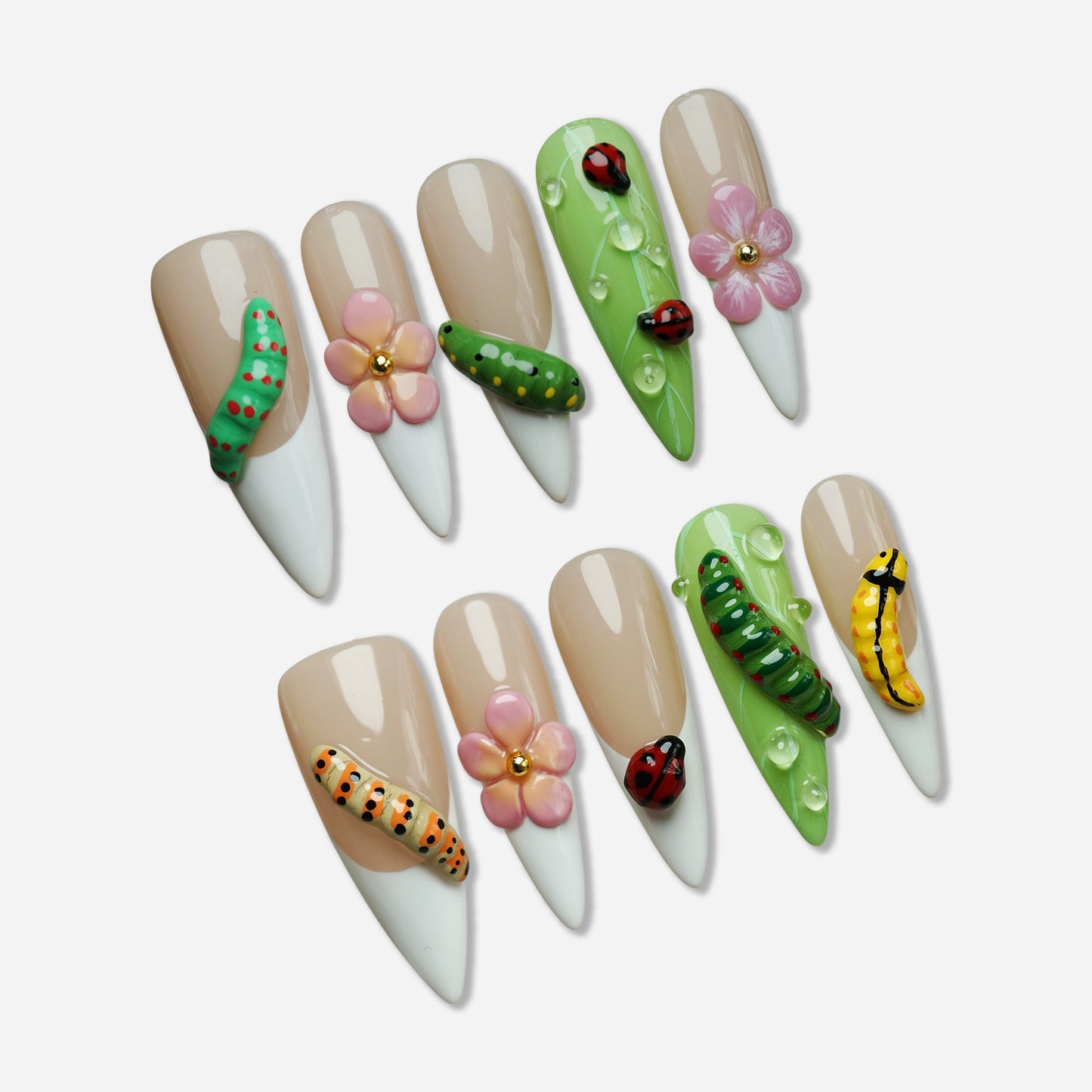 Mini Bug press-on nail set by Donailsart – nude and white nails with 3D caterpillars, tiny ladybugs, soft flowers, and glossy green details
