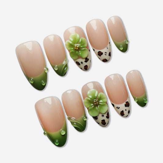 B7 | Palm Kiss press-on nail set by Donailsart – clean nude base nails with fresh green tips, delicate floral accents, and soft dewy details