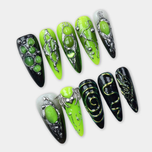 Press-on nails with acid green, galactic orbs, and claw-like chrome designs, perfect for a high-impact look

