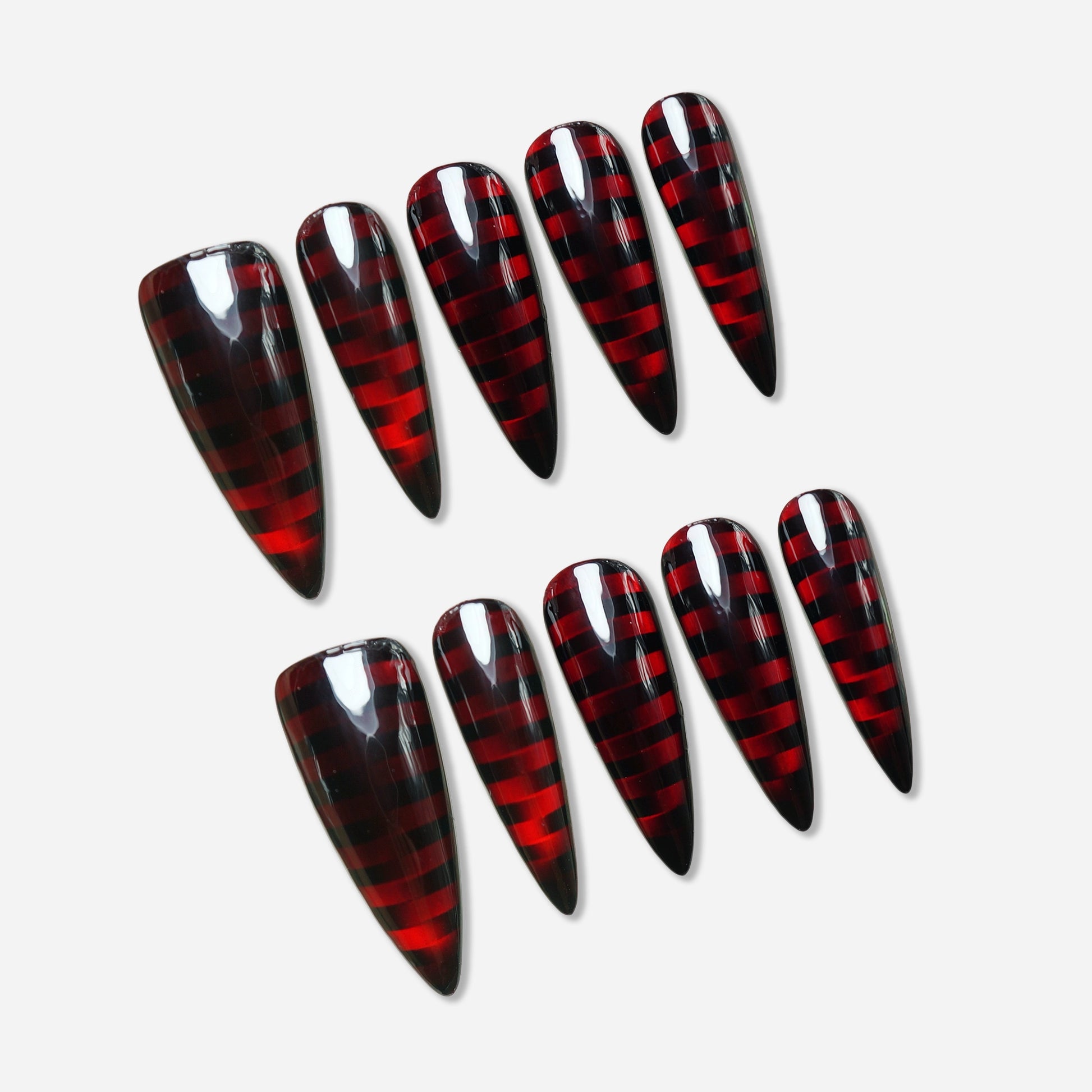 Riot Grid press-on nail set by Donailsart – glossy black nails with deep crimson translucent grid pattern creating a hypnotic punk-cyber plaid effect