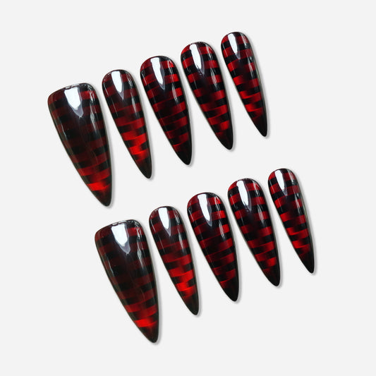 Riot Grid press-on nail set by Donailsart – glossy black nails with deep crimson translucent grid pattern creating a hypnotic punk-cyber plaid effect
