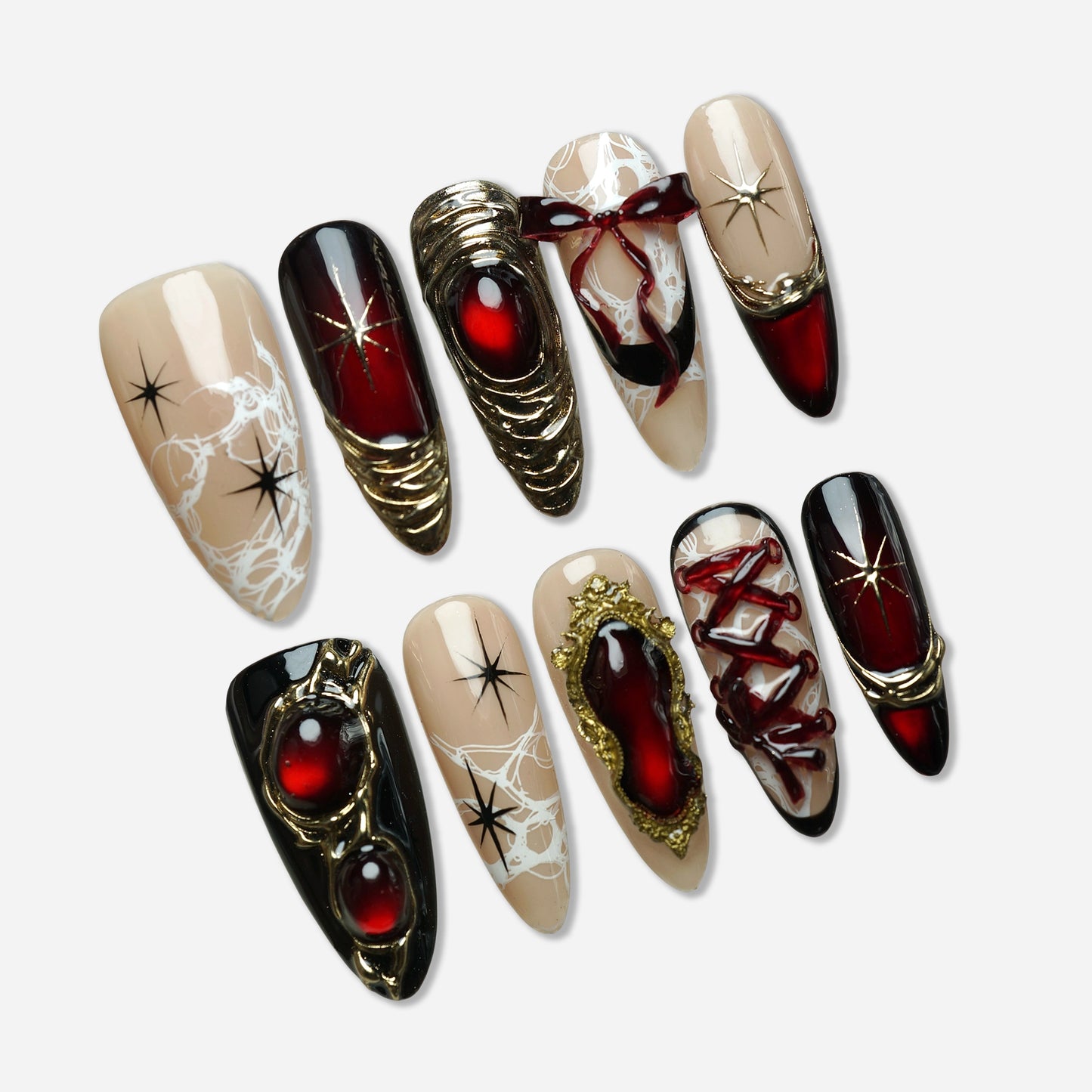 Royal Ruin press-on nail set by Donailsart – deep crimson chrome nails with sculpted gold details, corset lacing, and ribbon accents