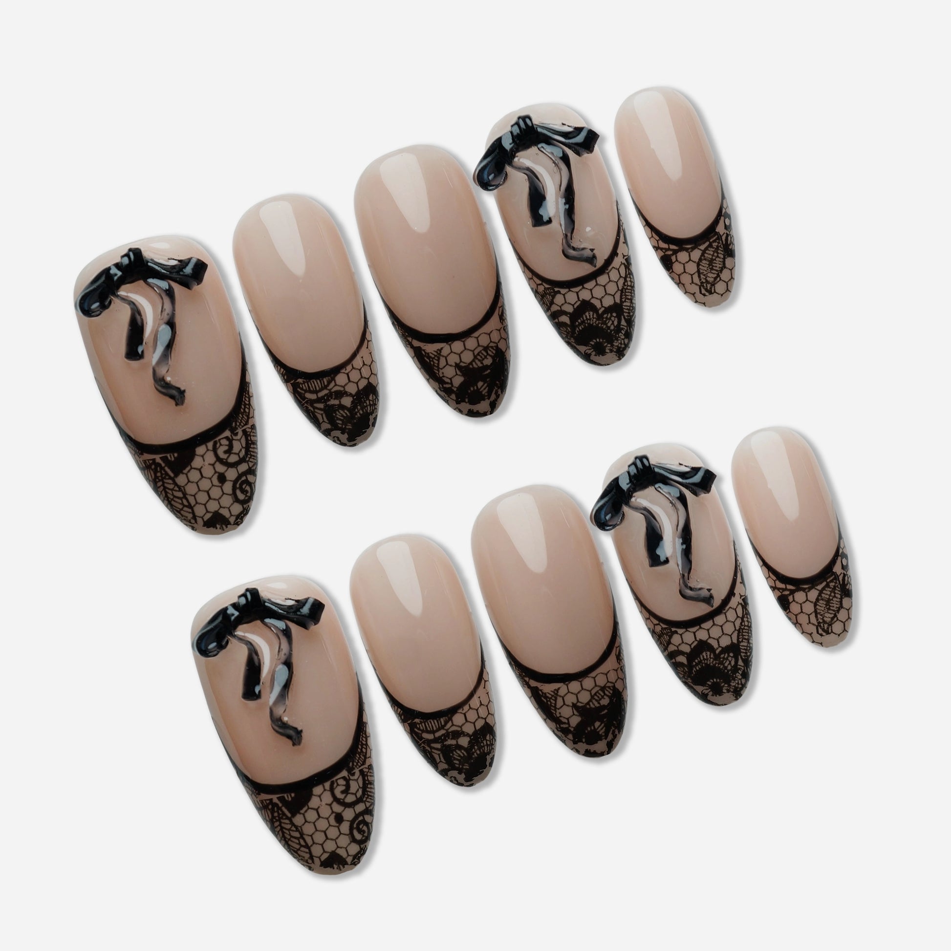 B4 | Sexy Lady press-on nail set by Donailsart – sheer nude base nails with delicate black lace-effect tips and sculpted ribbon accents