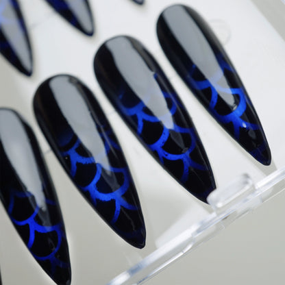 Siren Scale nail art detail view of layered reflective cobalt blue scales on glossy black press-on nails – Donailsart