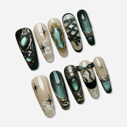 Velour Noire press-on nail set by Donailsart – deep emerald cat-eye shimmer nails with sculptural gold accents, lace-inspired details, and soft nude tones