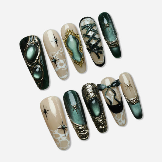 Velour Noire press-on nail set by Donailsart – deep emerald cat-eye shimmer nails with sculptural gold accents, lace-inspired details, and soft nude tones