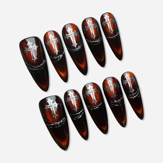 Vesper Fang press-on nail set by Donailsart – deep blood-red ombré to black nails with liquid glass gloss finish, silver cross details, and chain-inspired accents