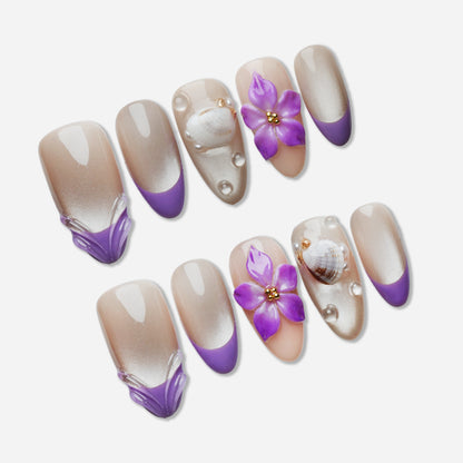 A28 | Violet Shore press-on nail set by Donailsart – pearl and lilac gradient nails with shimmer base, violet tips, sculpted petals, and shell accents