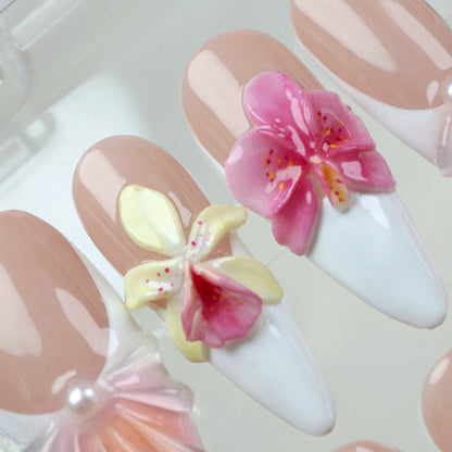 Romantic flower nails with hand-sculpted petals, delicate color blends, and pearl shell details on a nude French base