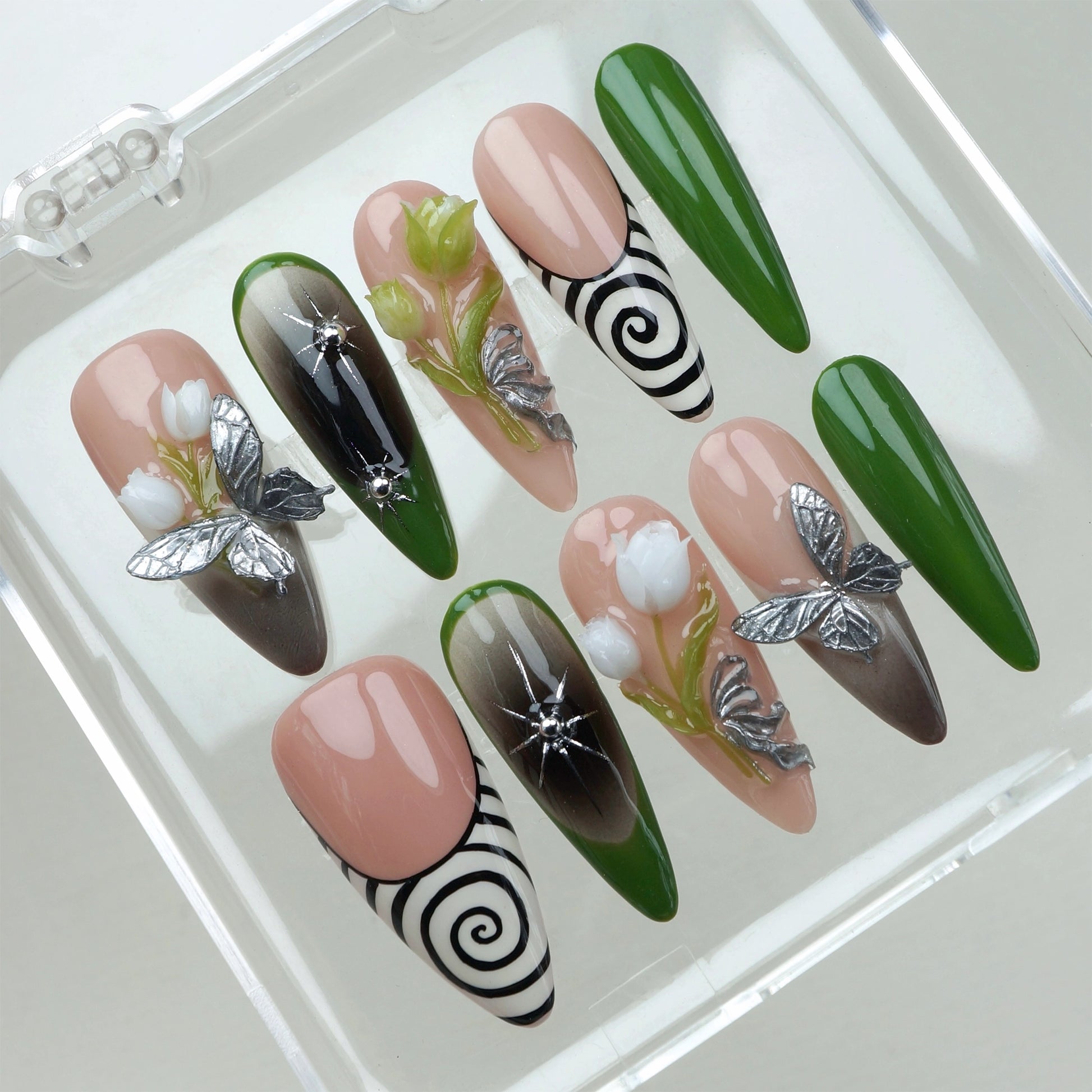 Flower nails with 3D blossoms, butterflies, and green ombré tips on nude press-on nails
