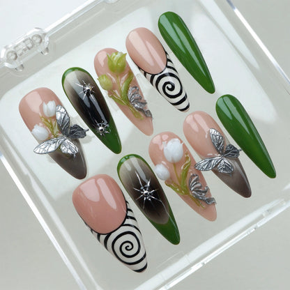 Flower nails with 3D blossoms, butterflies, and green ombré tips on nude press-on nails