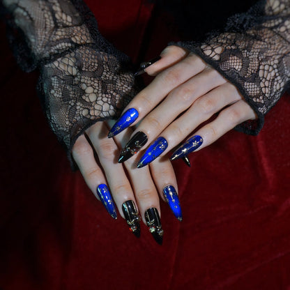 Midnight Carol royal blue and black stiletto press-on nails with gold star lines, full set on hand