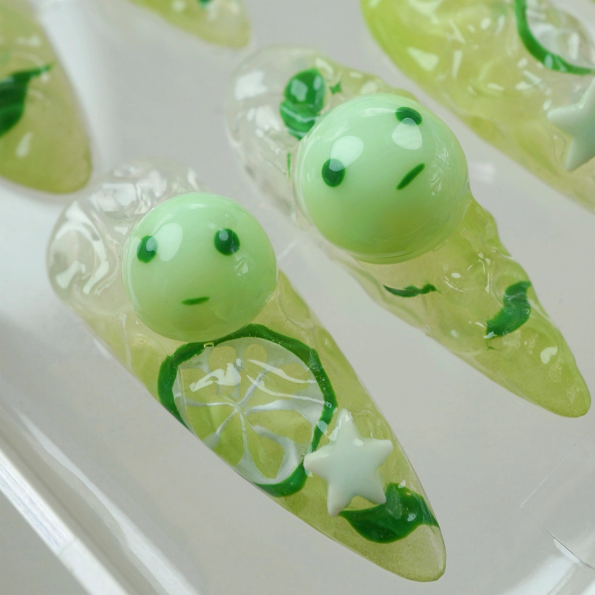 Donailsart glow-in-the-dark smiski nails with 3D citrus designs and translucent green characters for a playful, luminous finish