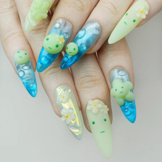 Nails with cartoon character design on a neutral background